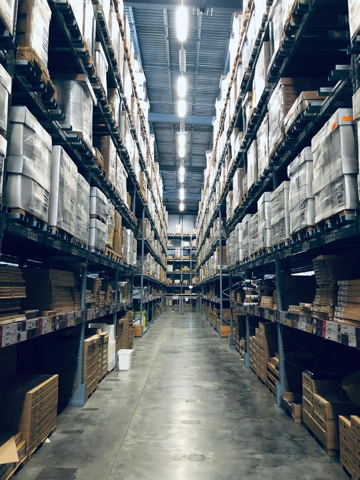 Organised warehouse aisle with palletised goods